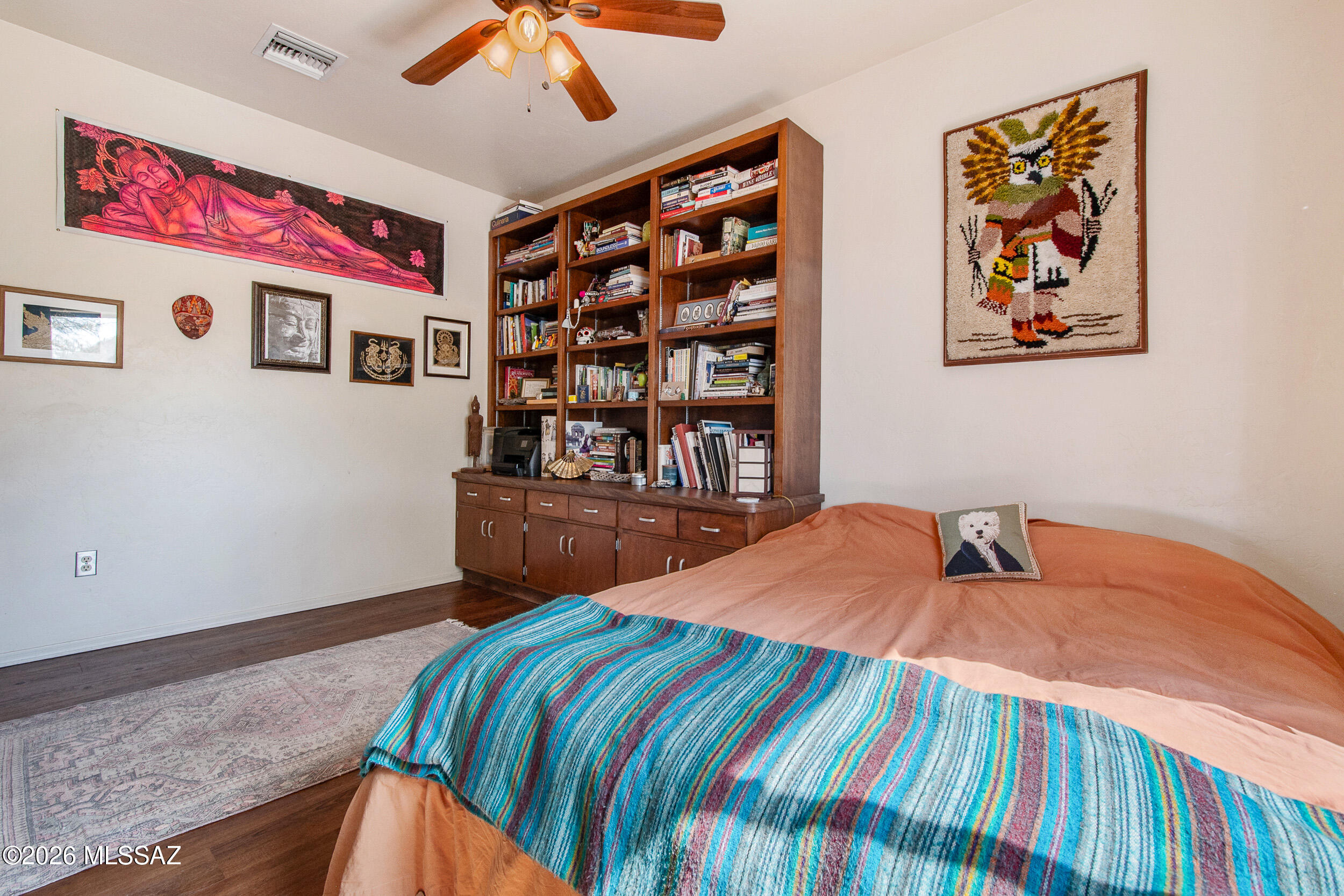 4155 West Coyote Ridge Trail Tucson, AZ 85746 - Photo 35 of 39 a bedroom with a bed and a bookshelf