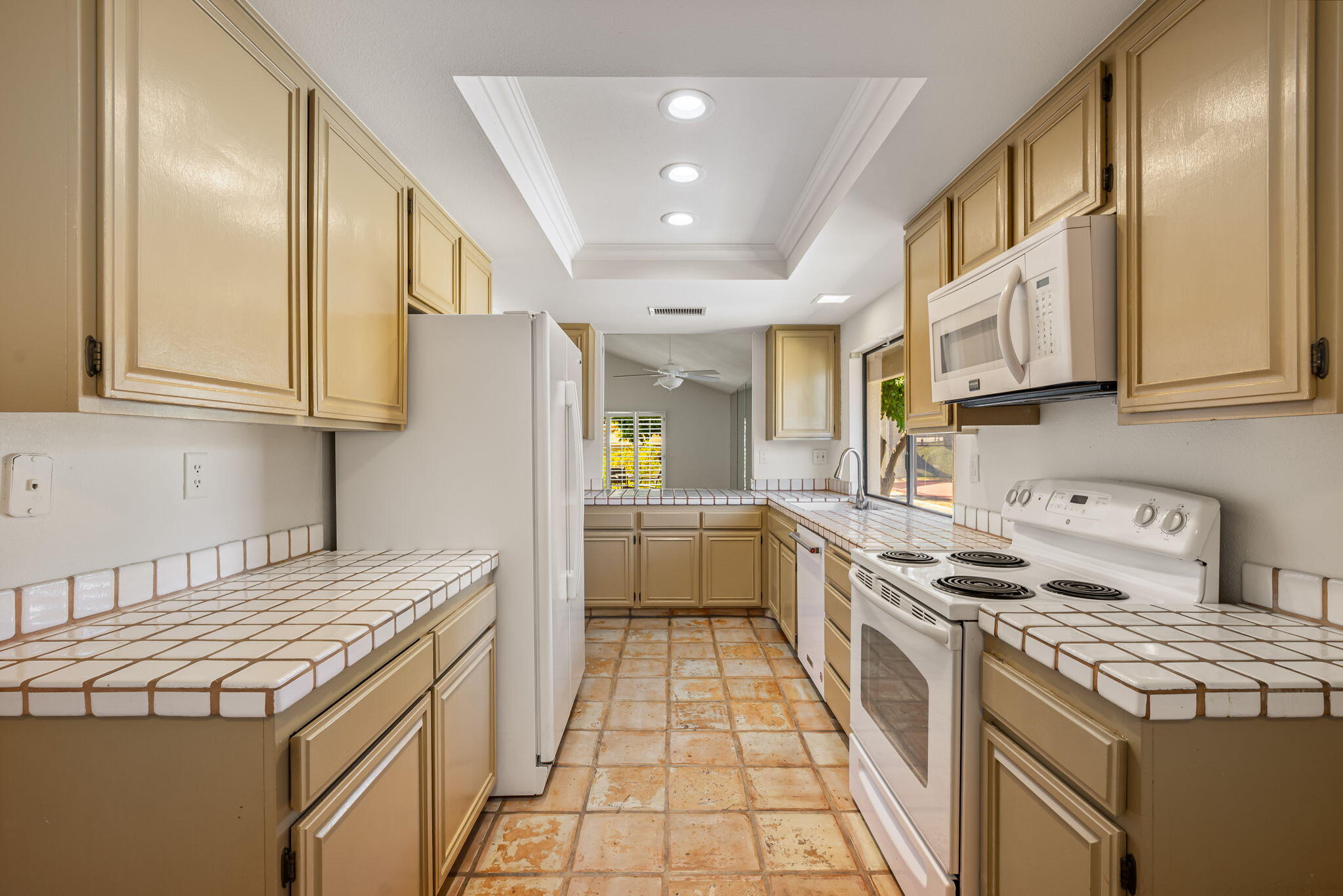 72499 Sandstone Lane Palm Desert, CA 92260 - Photo 47 of 53 a kitchen with stainless steel appliances a stove a sink and a refrigerator