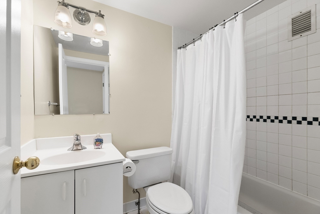 534 Beacon Street, Unit 302 Boston, MA 02215 - Photo 13 of 18 a bathroom with a sink a toilet and shower