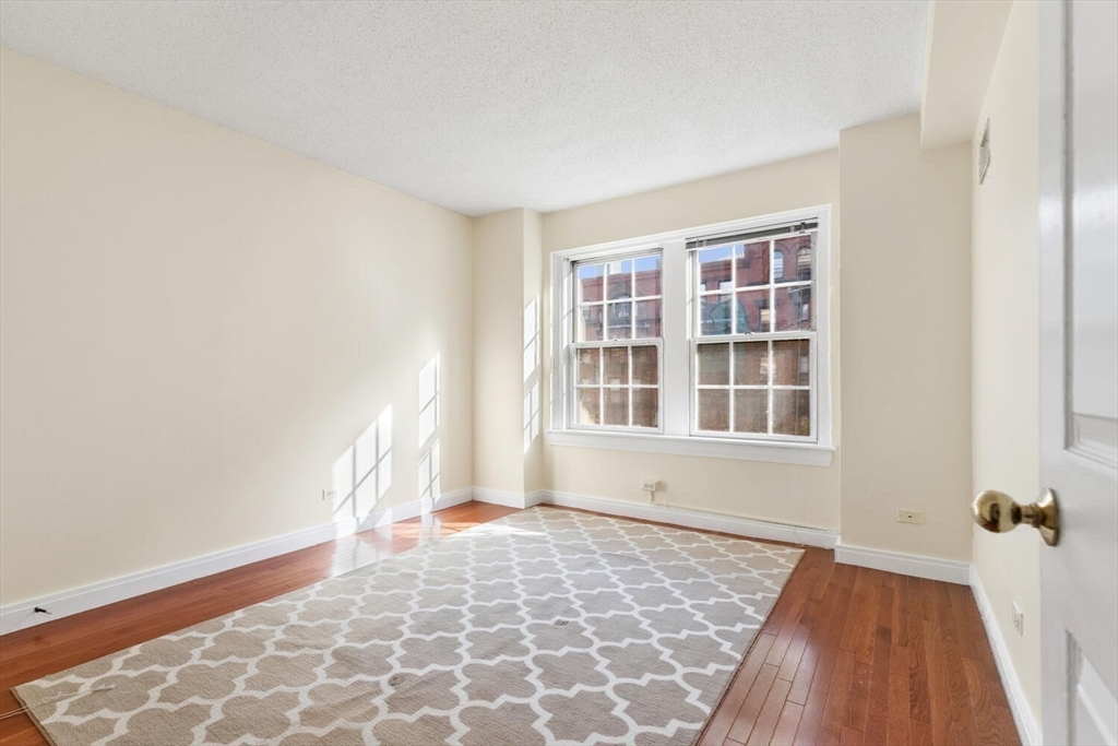 534 Beacon Street, Unit 302 Boston, MA 02215 - Photo 10 of 18 a view of an empty room with a window