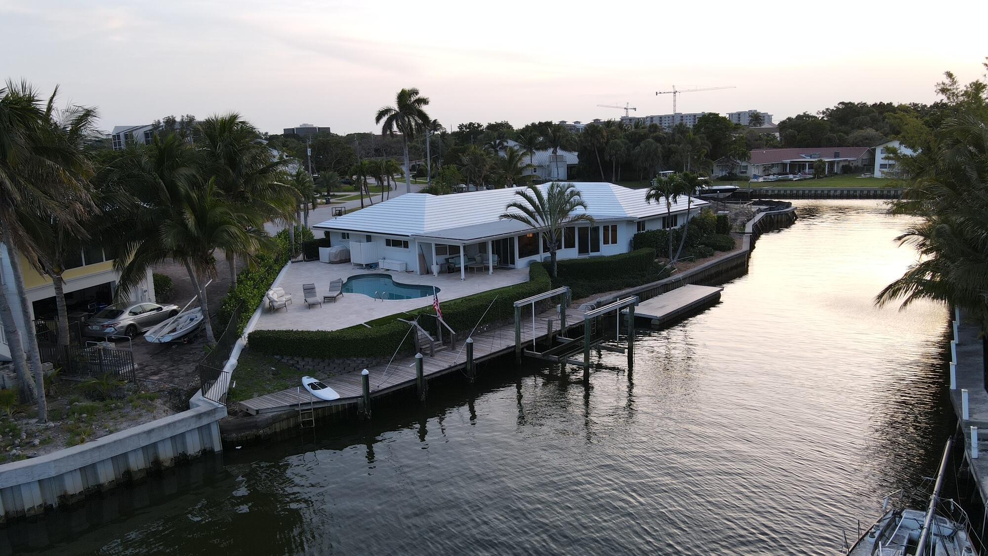 1459 Point Way North Palm Beach, FL 33408 - Photo 2 of 21 a view of a roof deck with lawn chairs wooden floor and fence