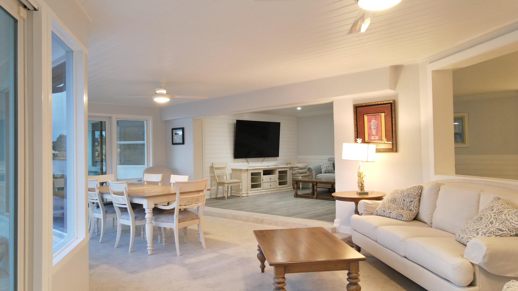 1459 Point Way North Palm Beach, FL 33408 - Photo 21 of 21 a living room with furniture wooden floor and a flat screen tv