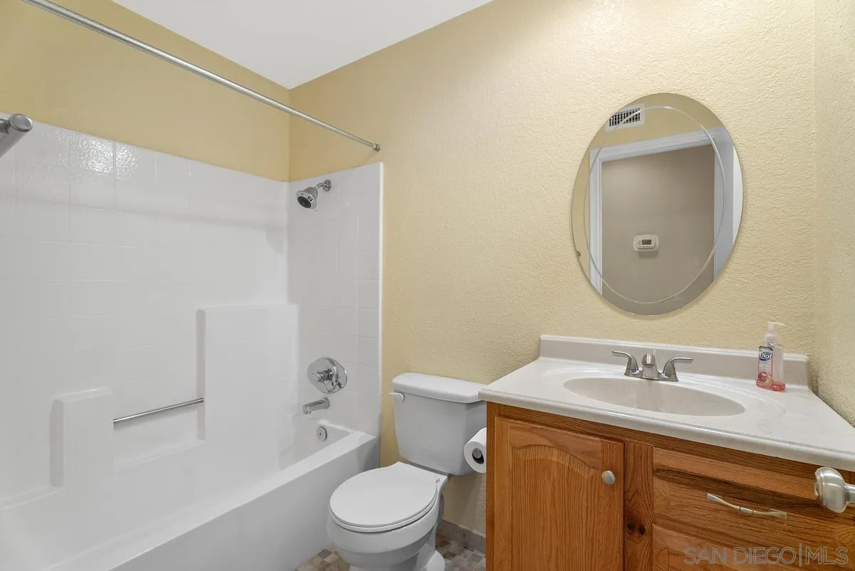 142 North Mine Canyon Road, Unit A Orange, CA 92869 - Photo 12 of 18 a bathroom with a sink toilet and shower