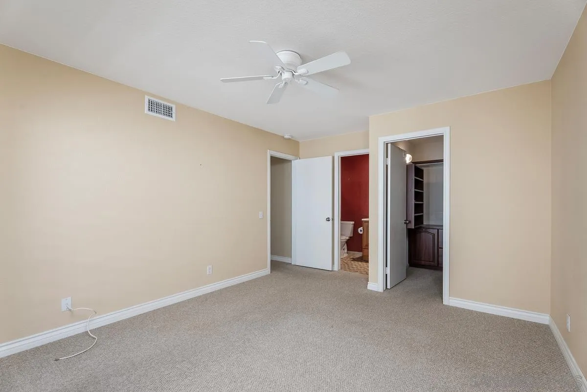 142 North Mine Canyon Road, Unit A Orange, CA 92869 - Photo 16 of 18 a view of an empty room with closet and a ceiling fan