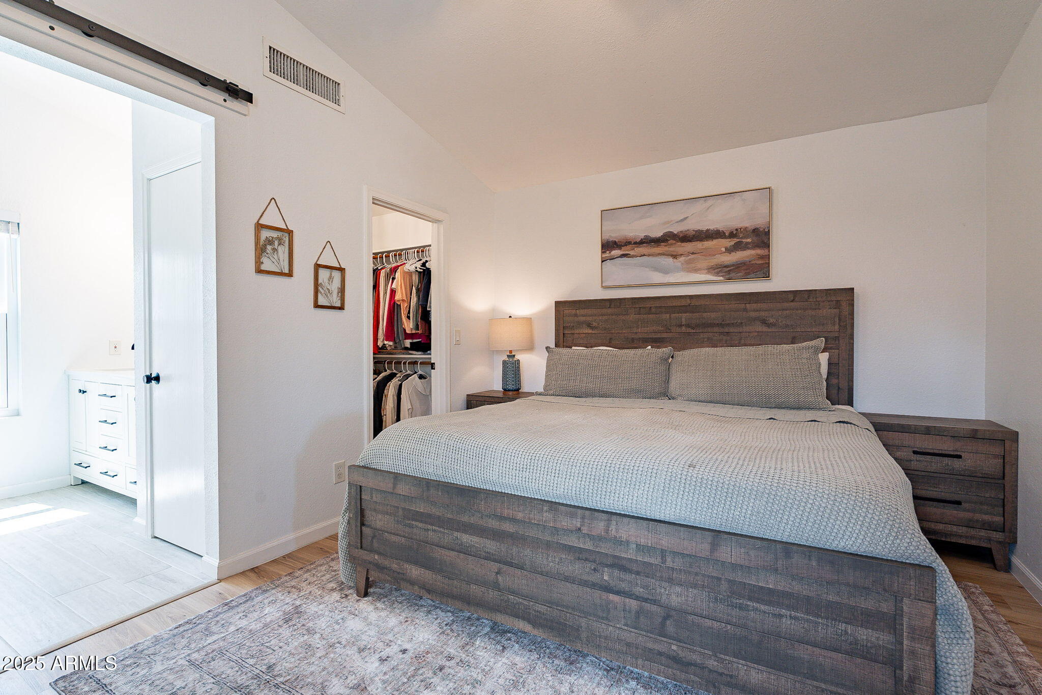 15026 South 28th Street Phoenix, AZ 85048 - Photo 19 of 40 a bedroom with a bed and a painting on the wall