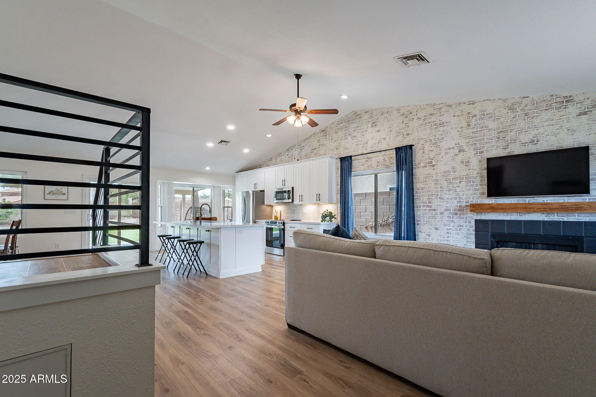 15026 South 28th Street Phoenix, AZ 85048 - Photo 3 of 40 a living room with furniture and a flat screen tv