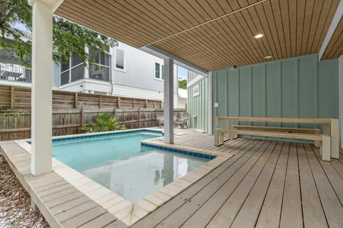 a view of swimming pool with seating space