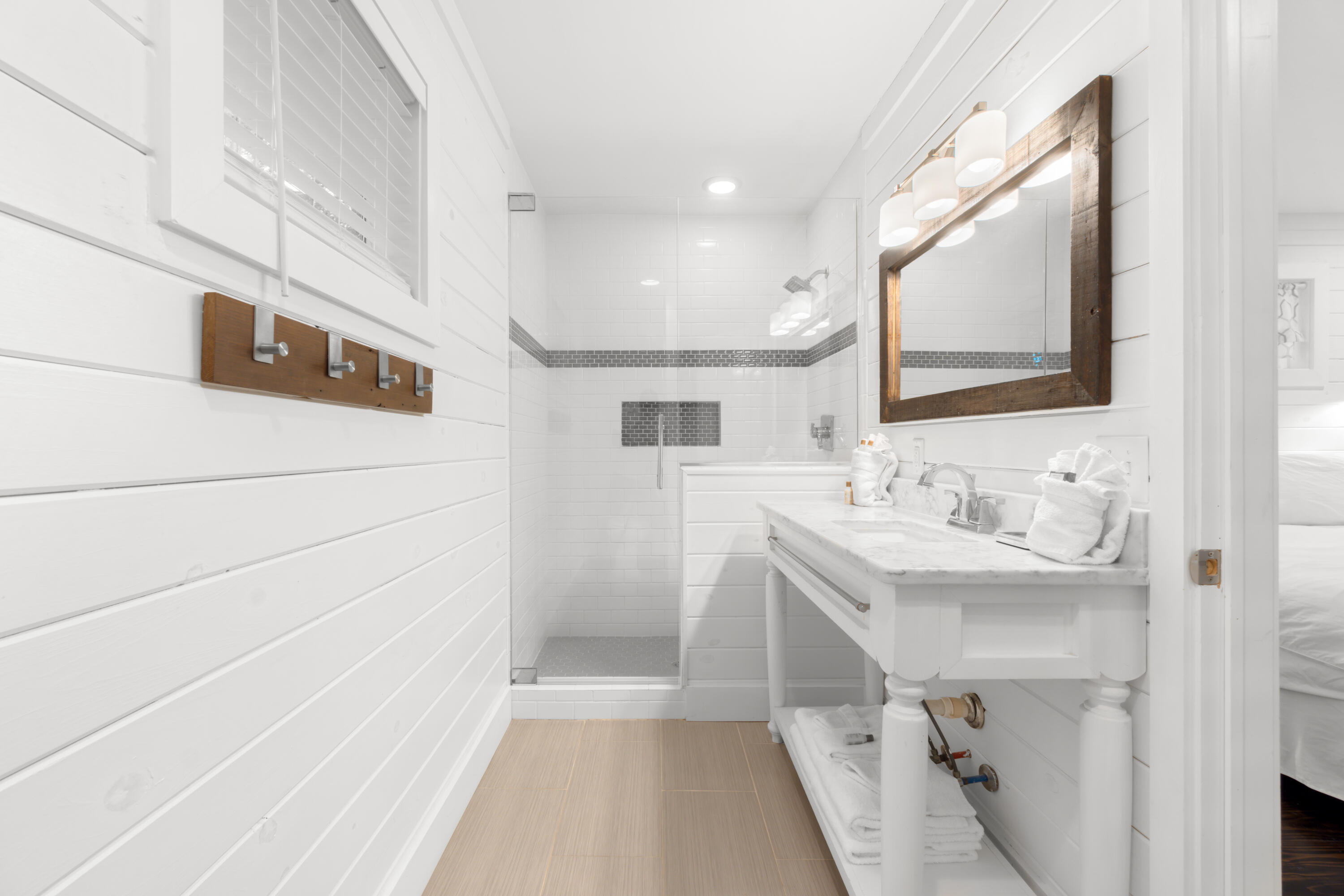 127 Dogwood Street Santa Rosa Beach, FL 32459 - Photo 15 of 22 a bathroom with a sink a mirror and a shower