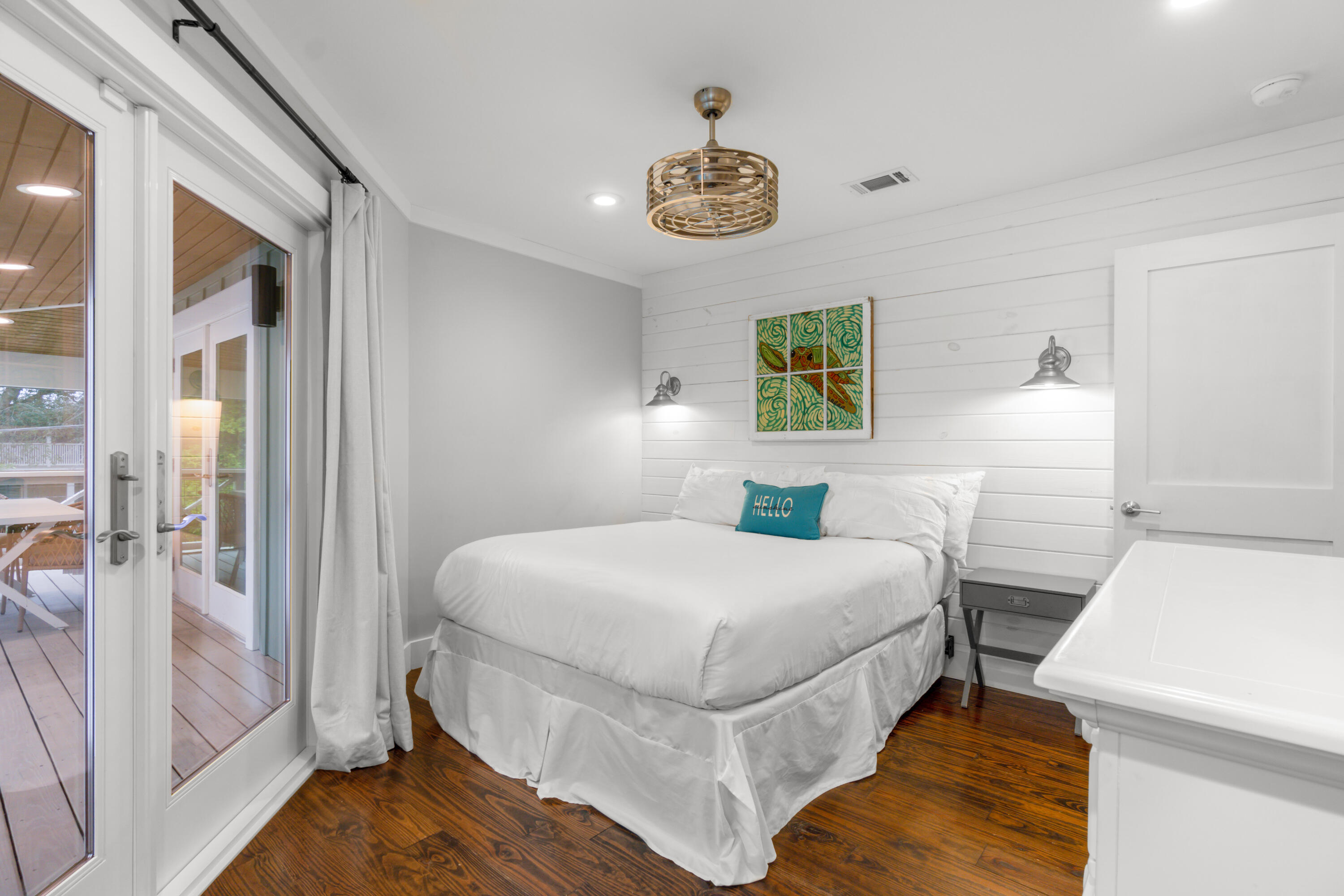 127 Dogwood Street Santa Rosa Beach, FL 32459 - Photo 19 of 24 a bedroom with a bed and a chandelier