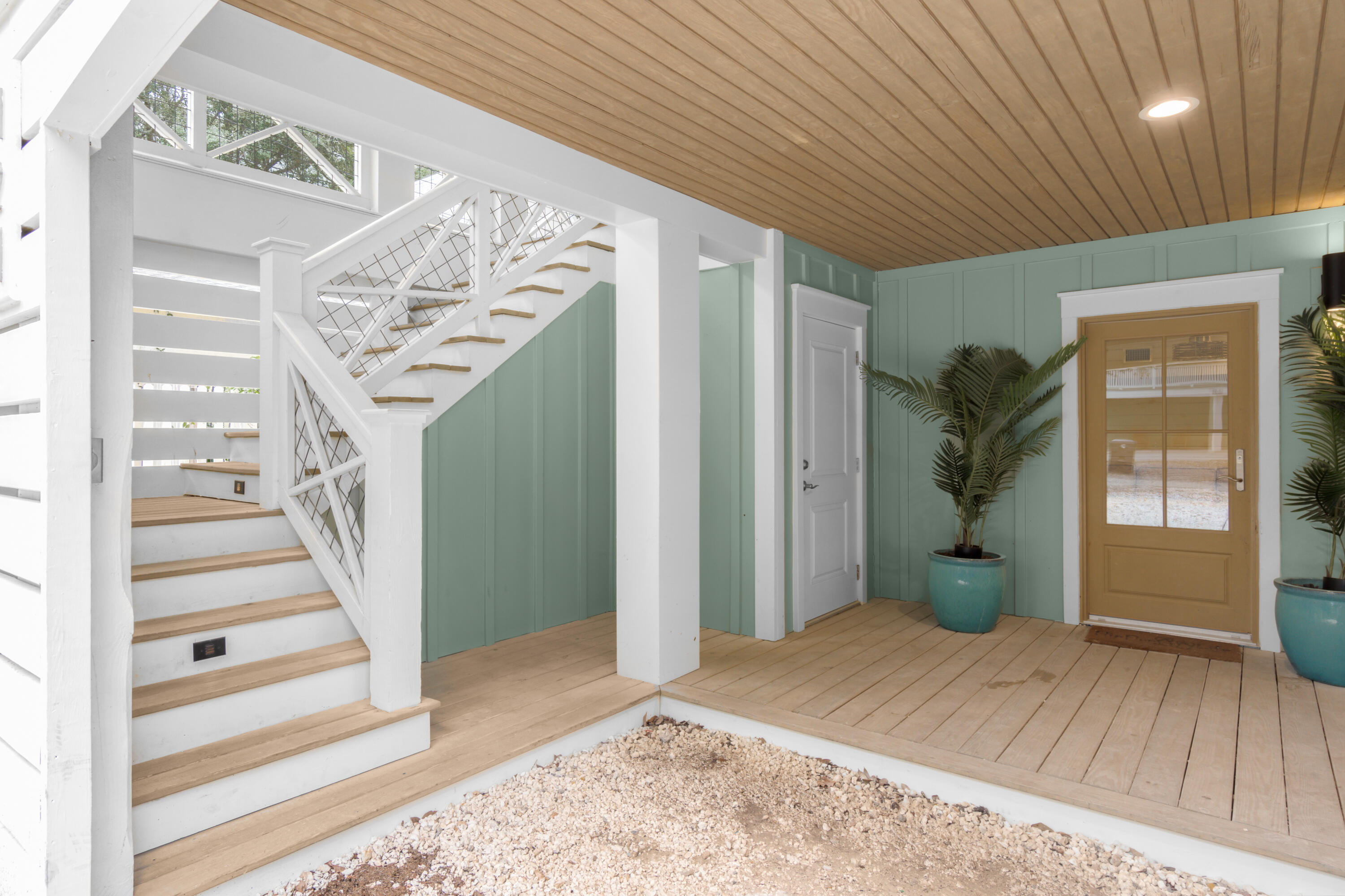 127 Dogwood Street Santa Rosa Beach, FL 32459 - Photo 6 of 22 a view of a livingroom with wooden floor and stairs