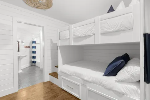 a bedroom with a bed and white walls