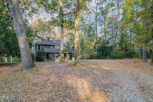 a view of a house with a tree