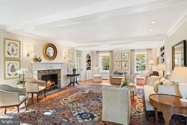 a kitchen with stainless steel appliances kitchen island granite countertop a table chairs sink and cabinets