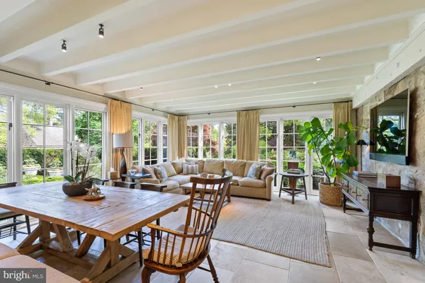 a living room with furniture fireplace and flat screen tv