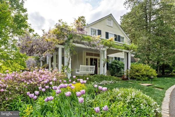 an aerial view of house with yard and outdoor seating