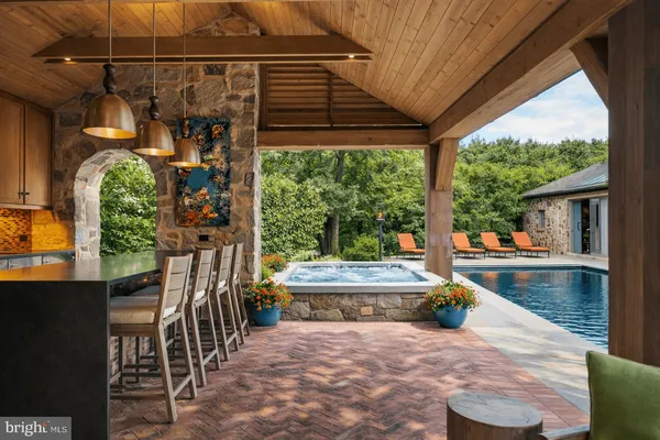 a view of swimming pool with lounge chair