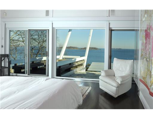 183 Byram Shore Road Greenwich, CT 06830 - Photo 13 of 20 a living room with furniture and large windows