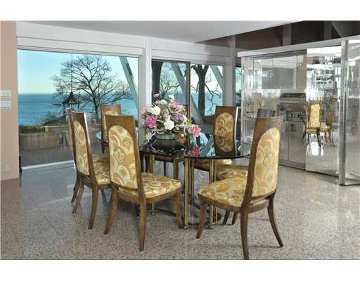 183 Byram Shore Road Greenwich, CT 06830 - Photo 16 of 20 a dining room with furniture and a floor to ceiling window