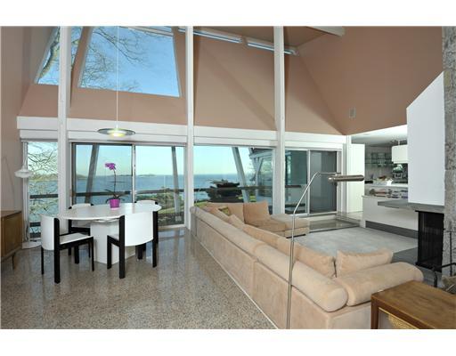 183 Byram Shore Road Greenwich, CT 06830 - Photo 6 of 20 a living room with furniture a large window and dining table