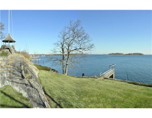 183 Byram Shore Road Greenwich, CT 06830 - Photo 9 of 20 a view of a lake with a yard
