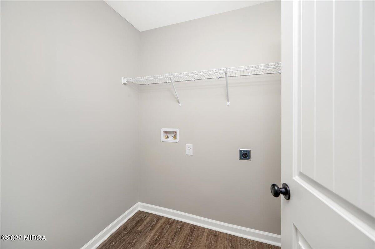 229 Davis Road Gray, GA 31032 - Photo 26 of 30 a view of a room with racks on the wall