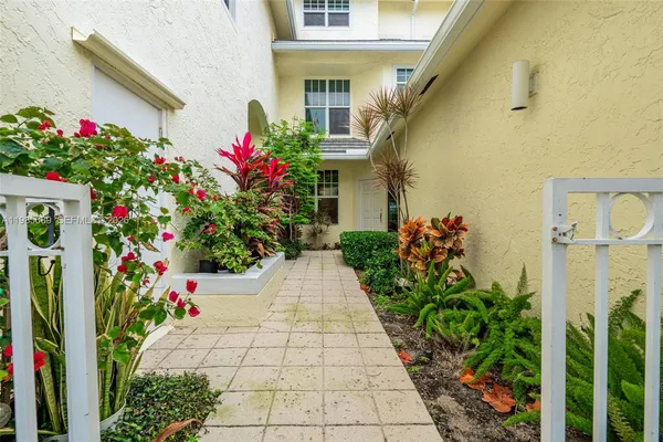a flower garden with flower flowers in front of it