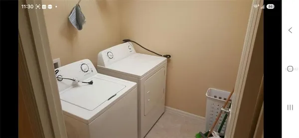 a utility room with dryer and washer