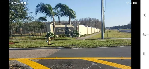 a view of a swimming pool with a yard