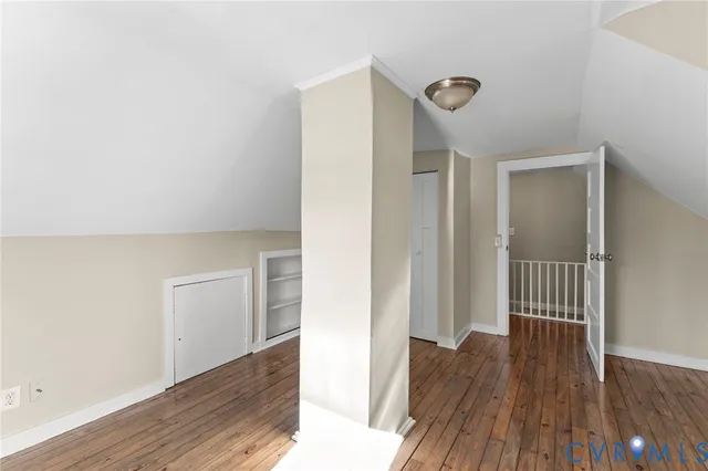 a view of hallway with wooden floor