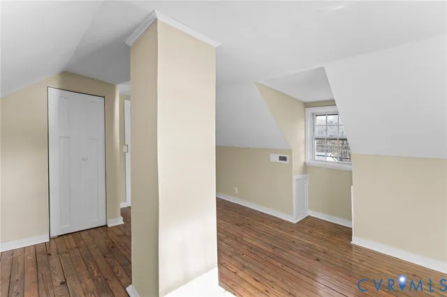 a view of hallway with wooden floor