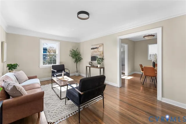 a living room with furniture and a table