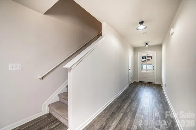 a view of entryway with wooden floor