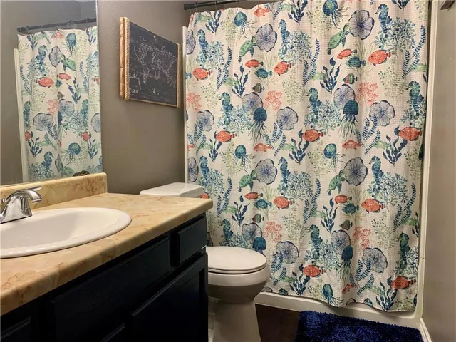 a bathroom with a sink and toilet