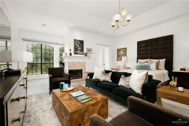 a living room with furniture fireplace and a flat screen tv