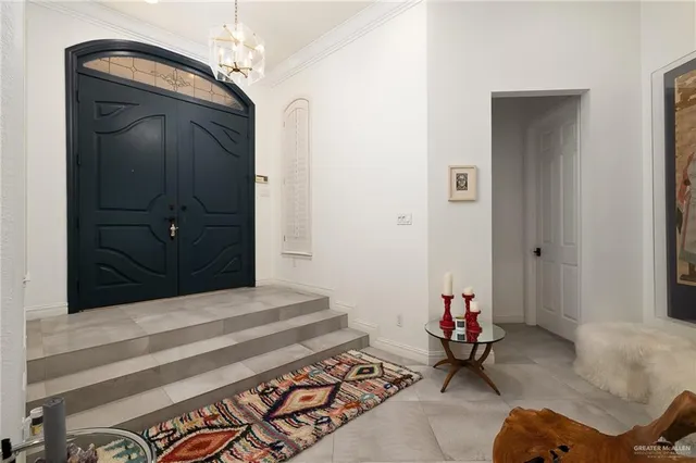 a living room with a bed and furniture