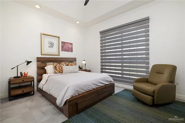 a bedroom with bed and a couch