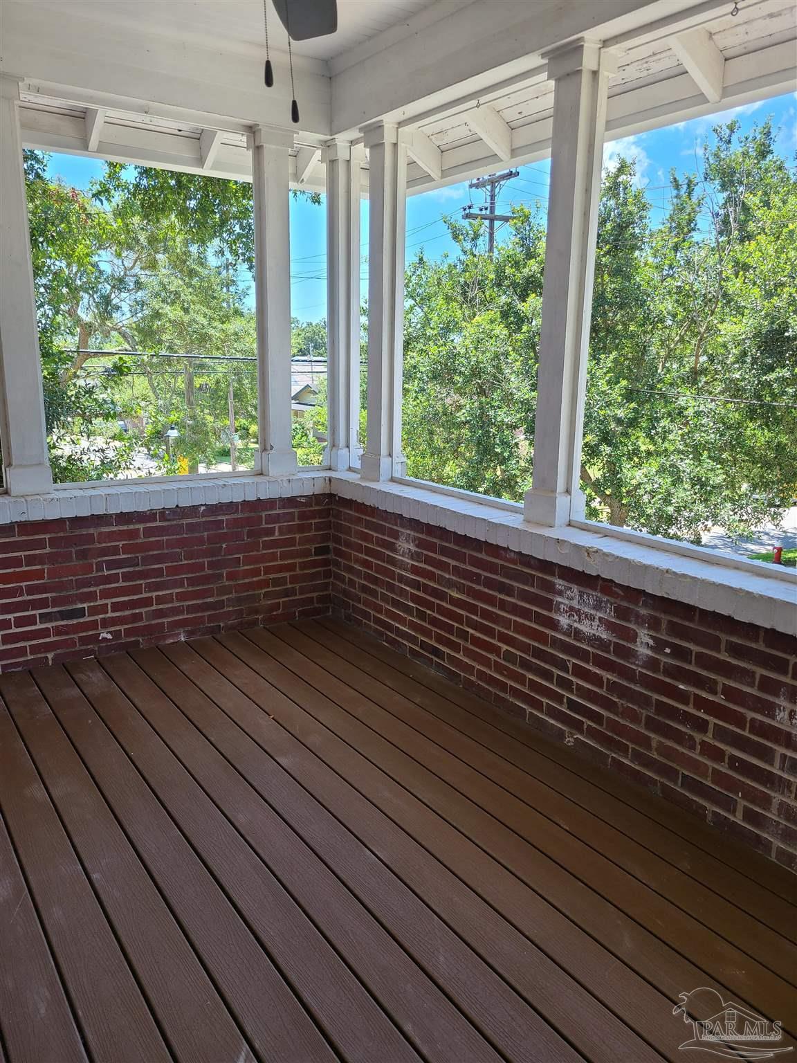 504 North Spring Street, Unit B Pensacola, FL 32501 - Photo 13 of 14 a view of a balcony with wooden floor