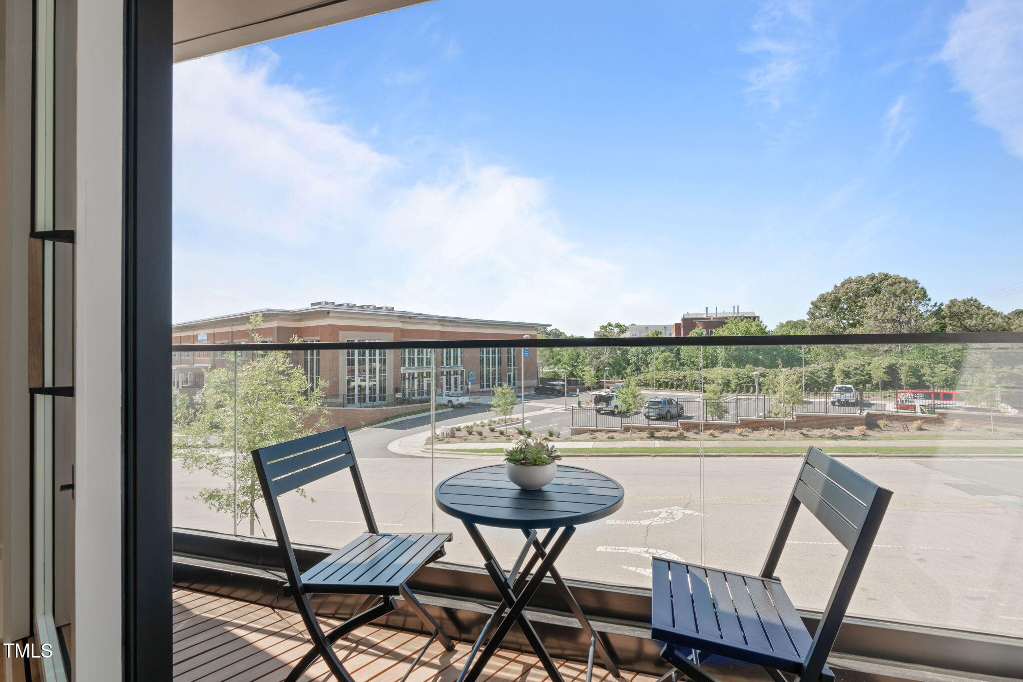 1301 Chamblee Hill Raleigh, NC 27608 - Photo 13 of 46 a terrace with outdoor seating and city view