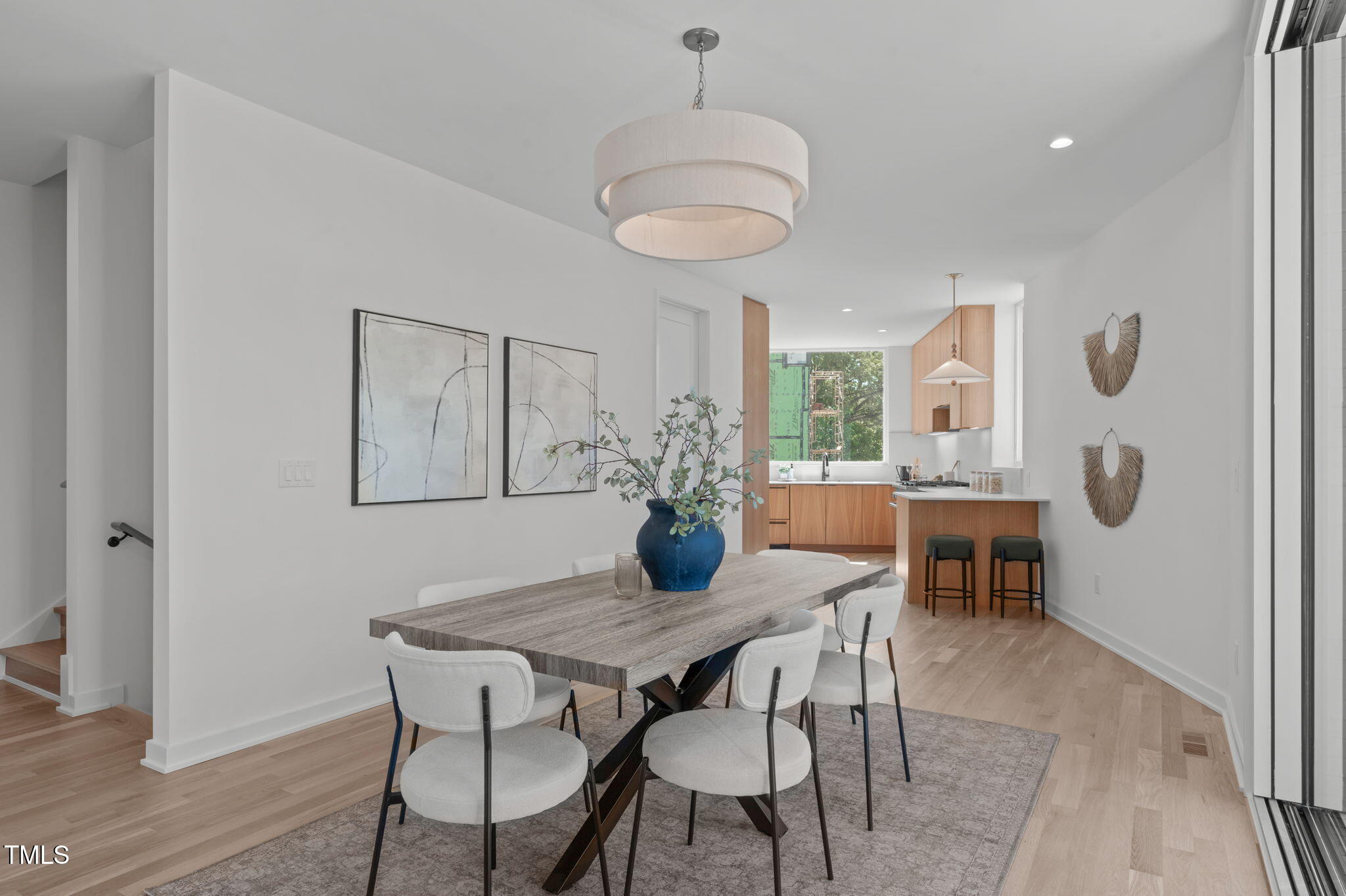 1301 Chamblee Hill Raleigh, NC 27608 - Photo 14 of 46 a view of a dining room with furniture window and wooden floor