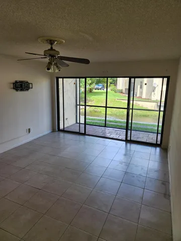 a view of empty room with floor to ceiling window