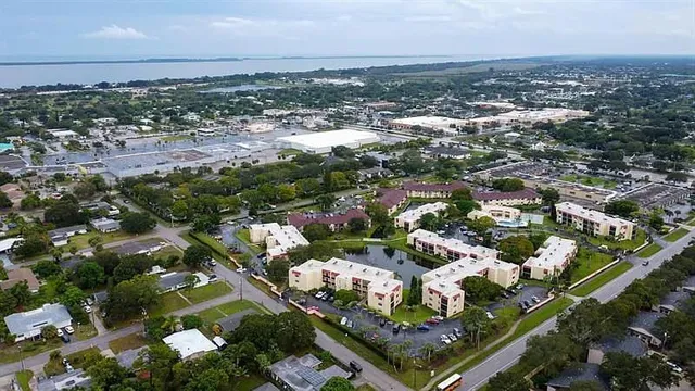 a living room with pool table and windows