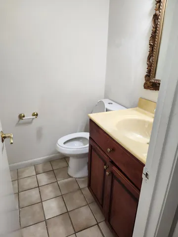 a bathroom with a sink toilet and vanity