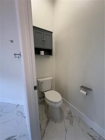a bathroom with a toilet and a sink