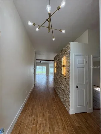 a view of entryway with wooden floor