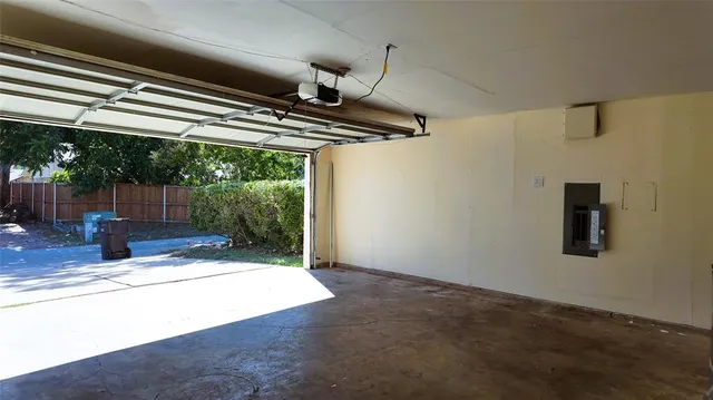 a view of a yard in front of a house with a fountain