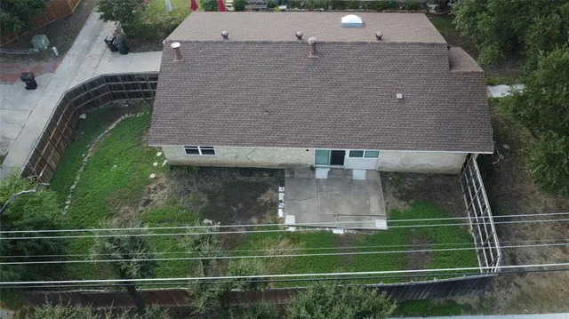 an aerial view of house with yard