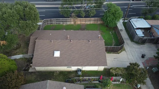 an aerial view of a house with swimming pool
