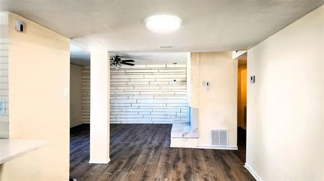 a view of hallway with wooden floor