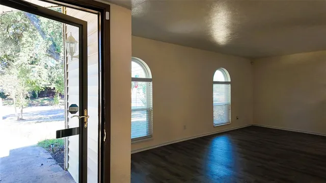 a kitchen with granite countertop a sink stainless steel appliances and cabinets