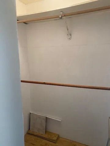 a view of small space with racks on the wall